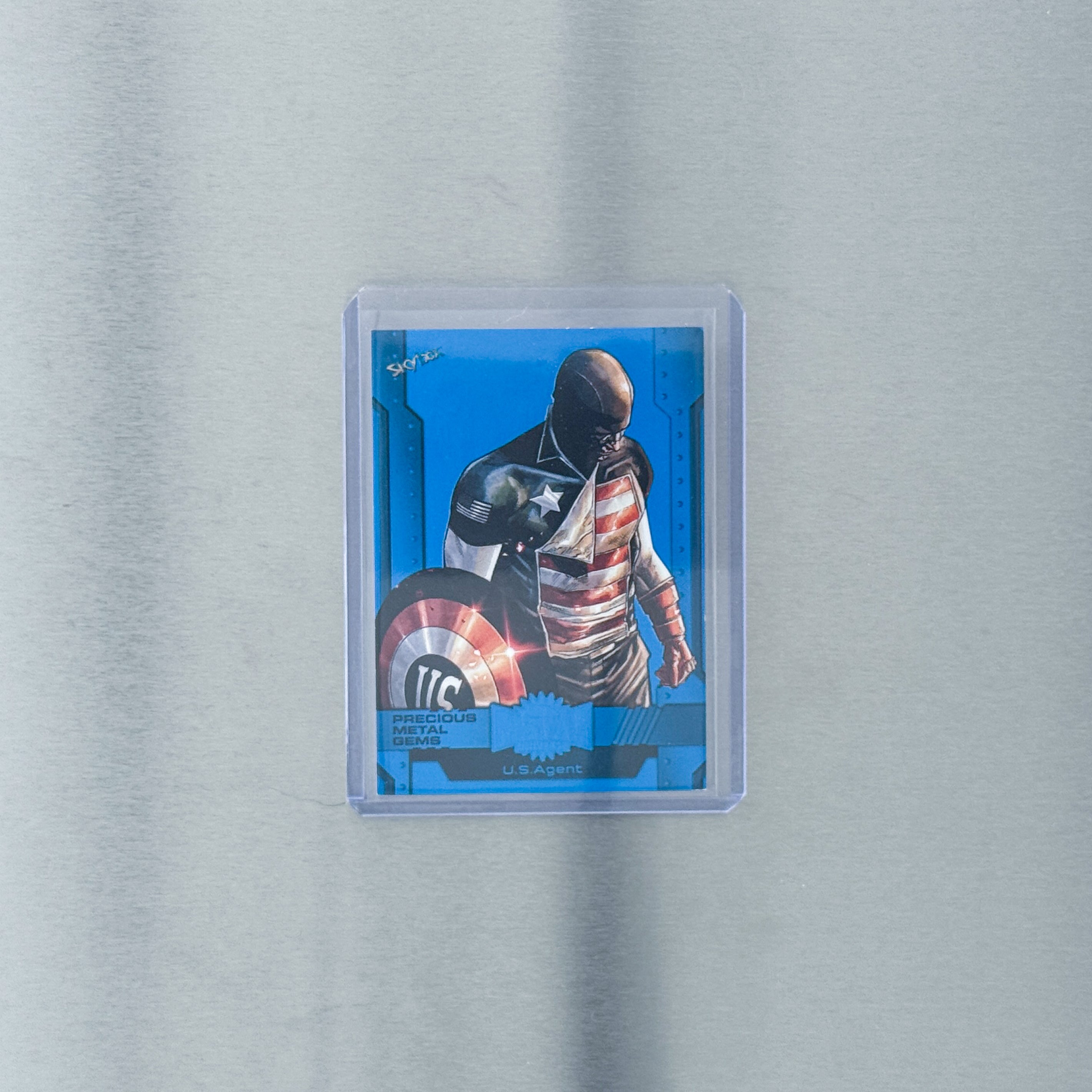 2024 SkyBox Metal Universe Avengers - Comic - Avengers - US Agents Blue Metal Gem 13/50
