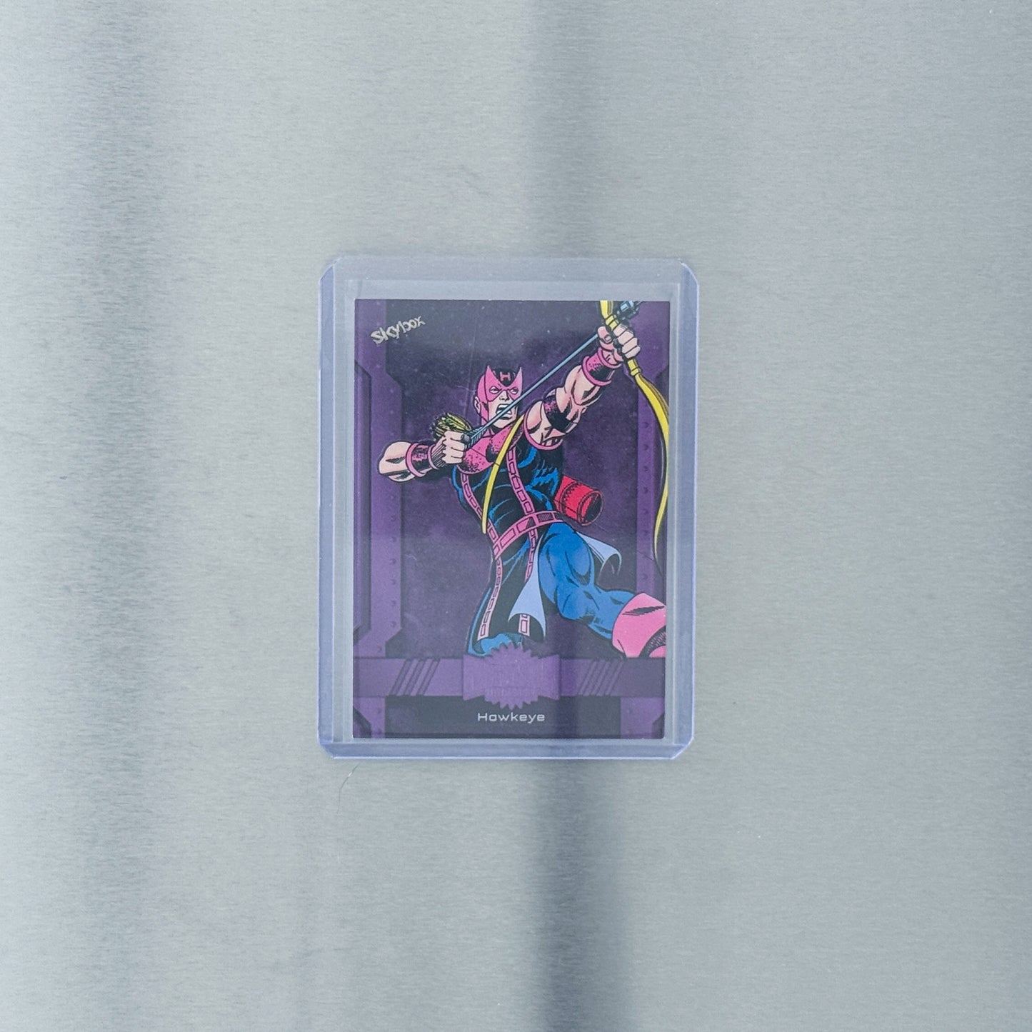 2024 SkyBox Metal Universe Avengers - Comic - Hawkeye purple 1/199