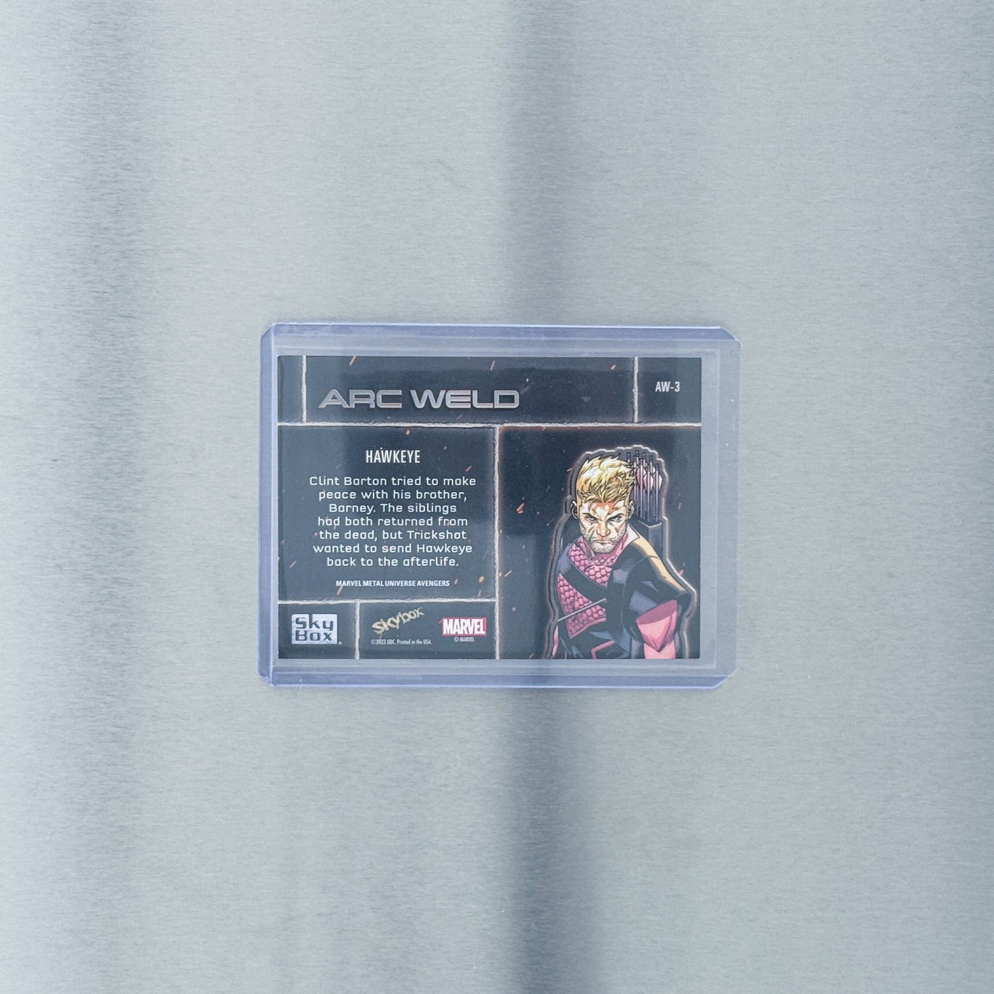2024 SkyBox Metal Universe Avengers - Comic - Hawkeye purple 1/199