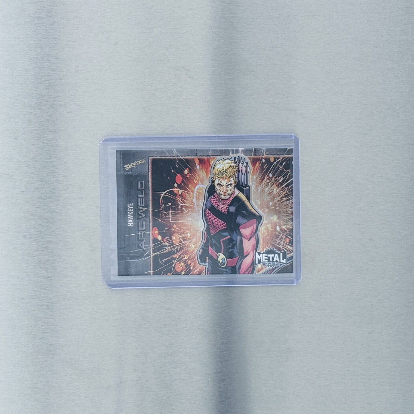 2024 SkyBox Metal Universe Avengers - Comic - Hawkeye purple 1/199